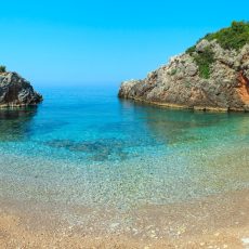Morning summer Ionian sea coast view with beach, Albania. Two shots stitch panorama.